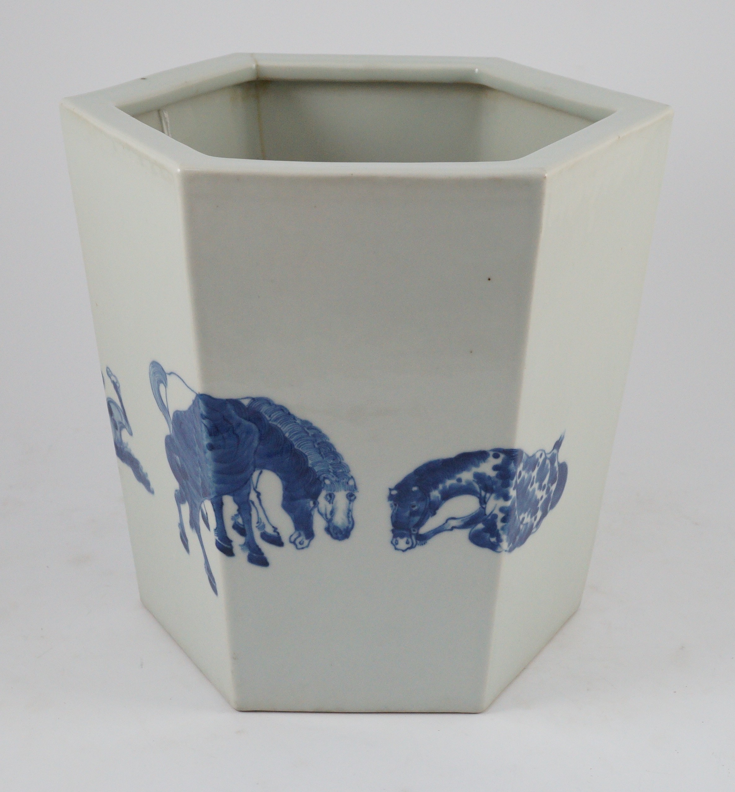 A Chinese blue and white hexagonal jardiniere, Kangxi mark but 19th/20th century, 26.5cm high, 28cm wide, cracked